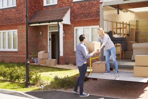 Furniture removals team loading household items in Highbury