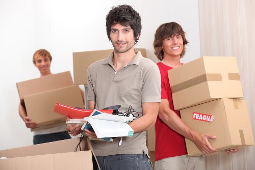 Removal team planning a house move in Highbury residential street