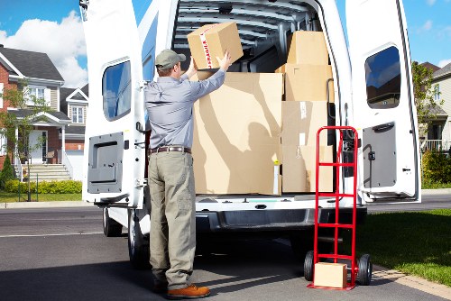 Removal van team assessing a property move before loading begins