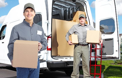 Careful packing of household items prepared for transport in Highbury