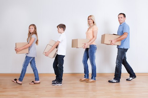 Local team handling office furniture and equipment in Highbury