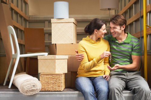 Professional movers handling a residential relocation in Highbury with stairs and narrow access